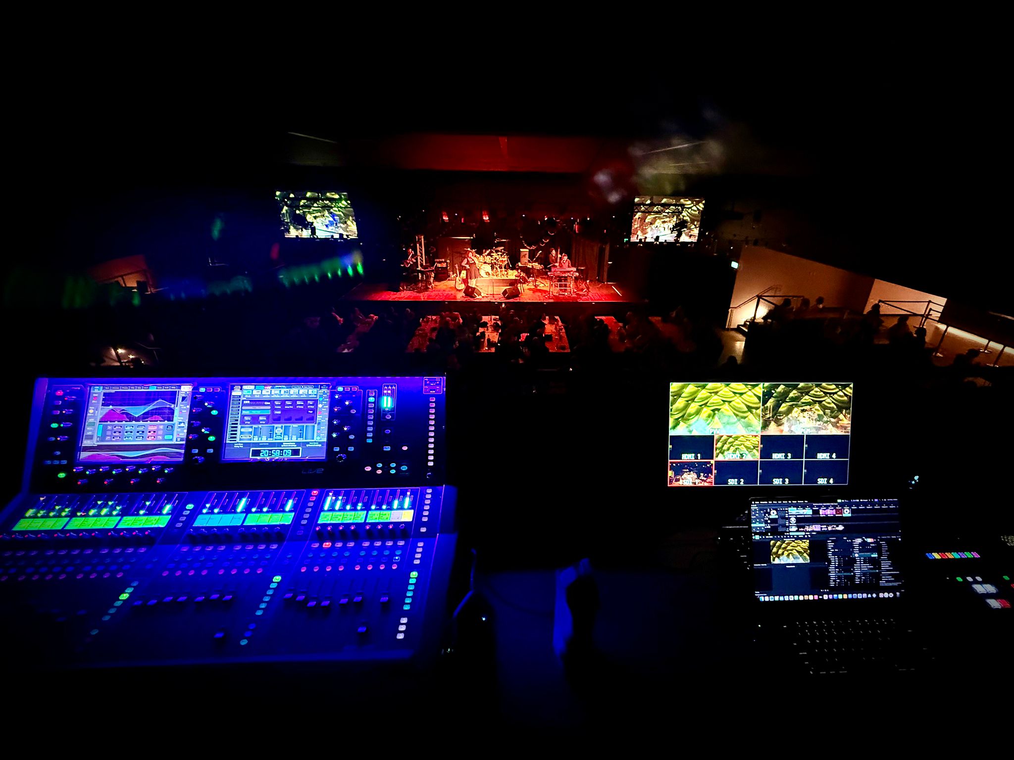 FOH mixing console overlooking live stage