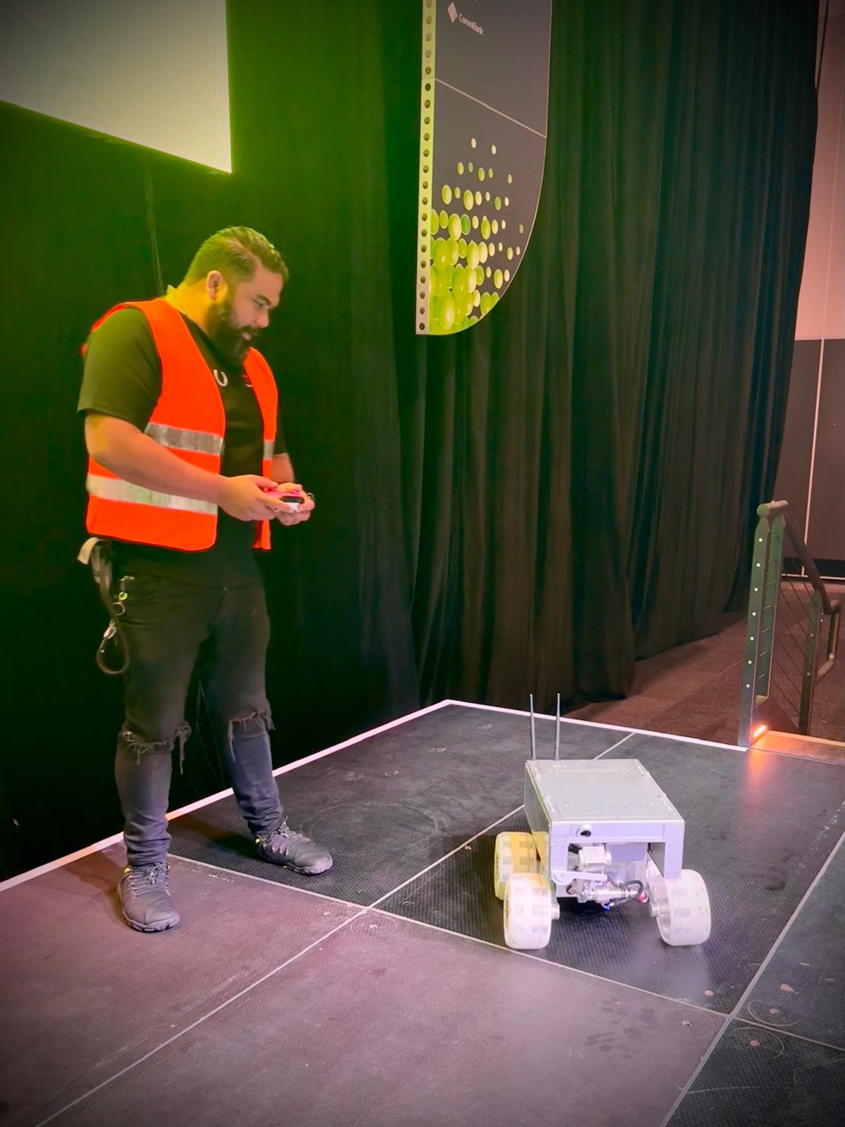 Crew operating robot on stage